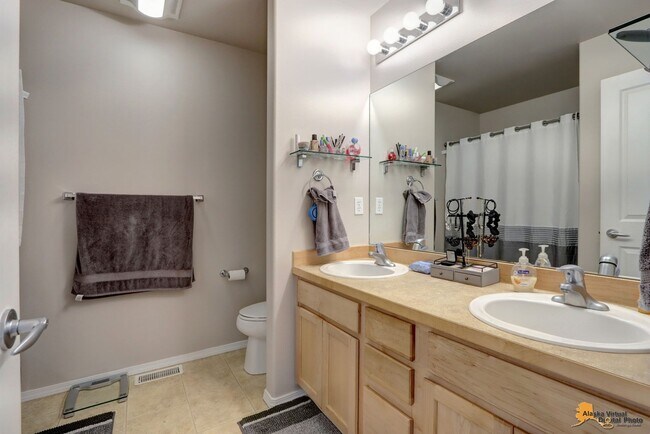 Building Photo - East Anchorage Home with Utilities Included!! Close to JBER! Attached Two Car Garage + Fenced in ...