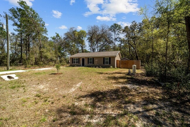 Building Photo - *** NOT READY FOR SHOW OR MOVE IN UNTIL AUGUST 1 *** Newer 3/2 in the country with fenced yard an...