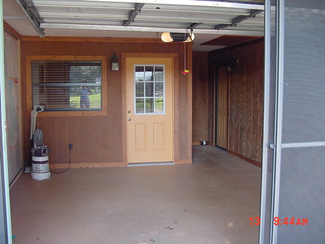 Garage w/screens & roll up door. First door opens to 2nd bedroom/office. Door to right opens to Liv - 5212 Bertsville Rd