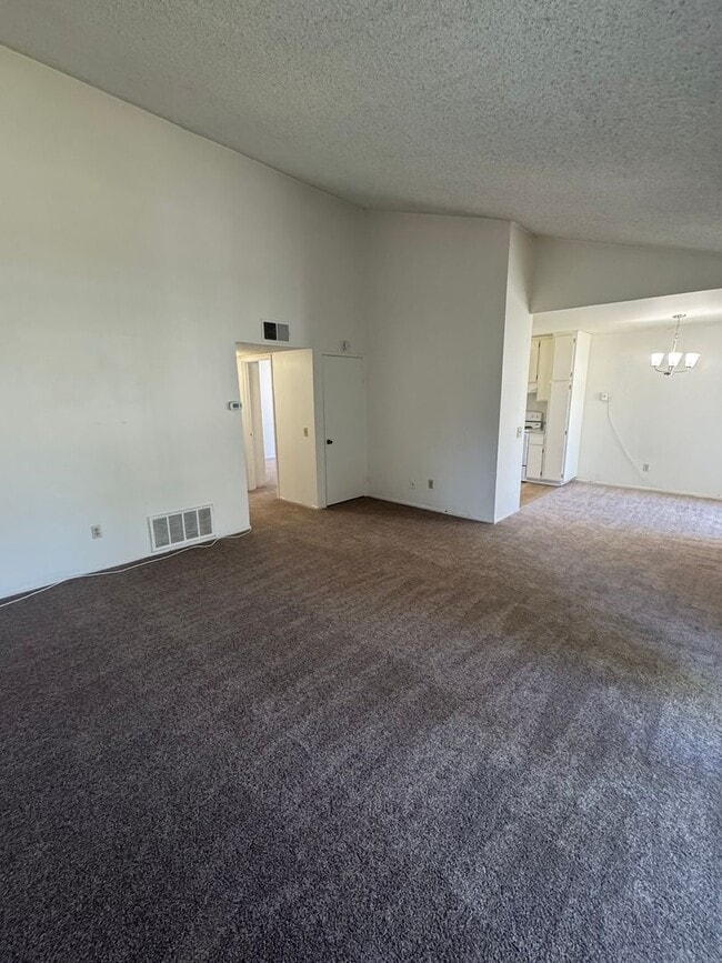 Building Photo - Upstairs two-bedroom 1/12 bath condo avail...