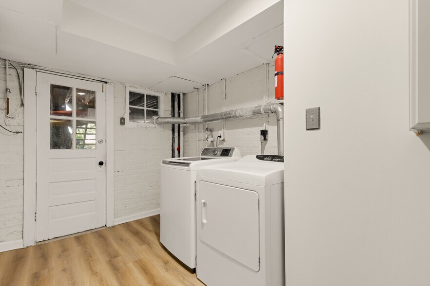 Shared laundry with the single upper unit. - 1636 44th St NW