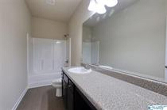 Building Photo - COMING SOON! Welcome to the Carlyle—where classic brick farmhouse charm meets a sleek, modern lif...