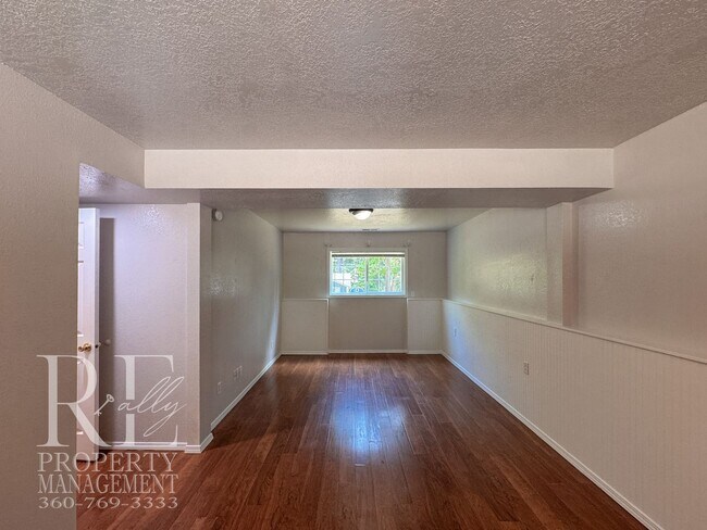 Building Photo - Freshly Painted East Bremerton Home with Expansive Decks & Flexible Living Space