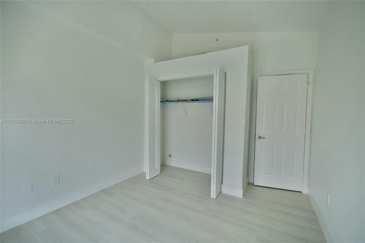 Downstairs bedroom with closet - 705 SW 148th Ave