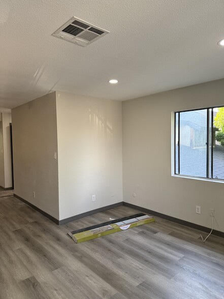 Open Living Room and Dinning Room. All new flooring, new carpets, and paint. - 1907 W Whitendale Ave