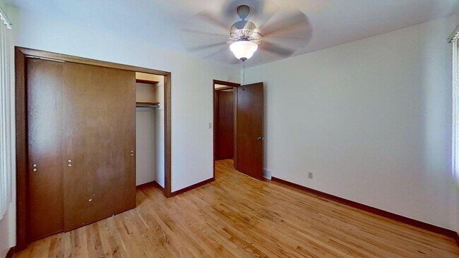 Building Photo - Updated two bedroom duplex, new stainless steel appliances, garage, and hardwood floors