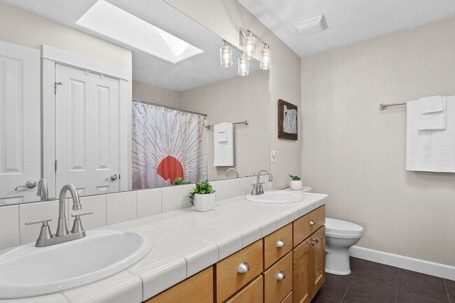 Building Photo - **Spacious 4-Bedroom Craftsman Home on Awb...