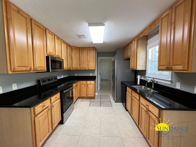 Building Photo - Spacious 3-Bedroom Retreat with New Kitchen Appliances!
