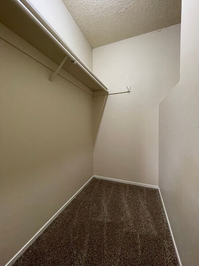 Building Photo - Two Story Fourplex Unit - On site Laundry, Carport, Ceiling Fans