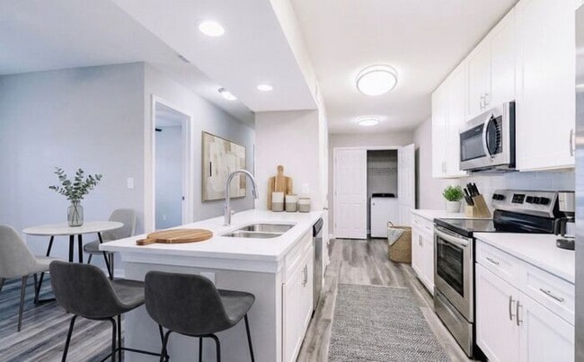 Building Photo - Spacious 2-Bedroom Elite Apartment with Private Balconies & Washer/Dryer