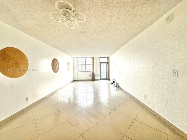Building Photo - 19390 Collins Ave
