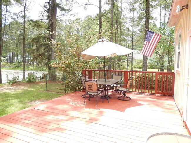 Building Photo - GLAMOROUS 3/2.5 w/ Pond View, Deck, Stainless Appliances, Wood Floors, Fireplace, & More! $2150/m...