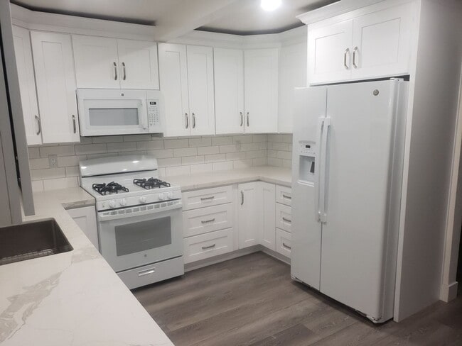 Building Photo - Beautifully Renovated Home with Updated Kitchen and bath, paint, and flooring! FREE SOLAR TOO!!!!