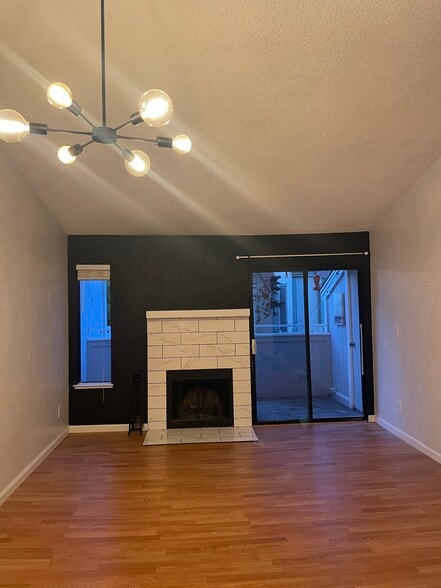 living room with balcony door - 250 Del Verde Cir