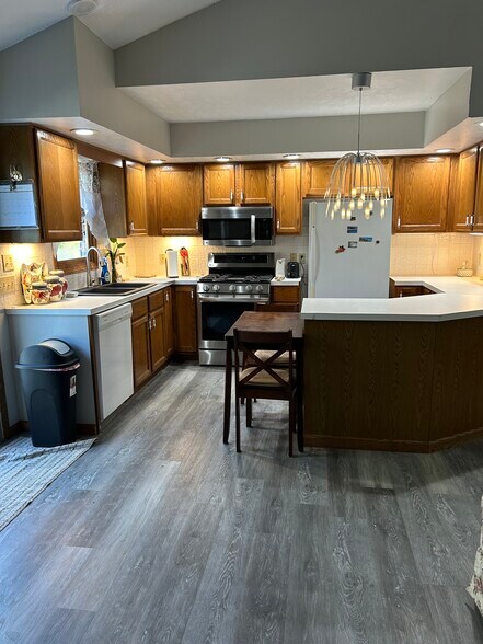 Open kitchen, stove and refrigerator is brand new - 3424 Martindale Rd NE