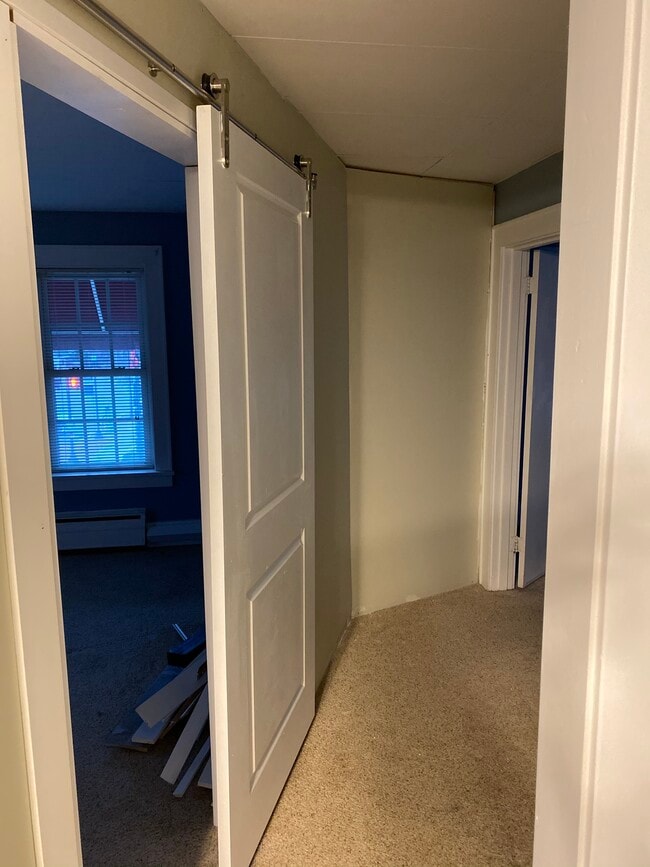 Hallway to bedrooms - 102 W Main St
