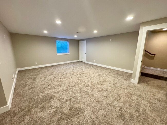 Building Photo - 4 BEDROOM, 3 BATHROOM TWINHOME WITH 2 CAR ATTACHED GARAGE IN NORTH CHEYENNE