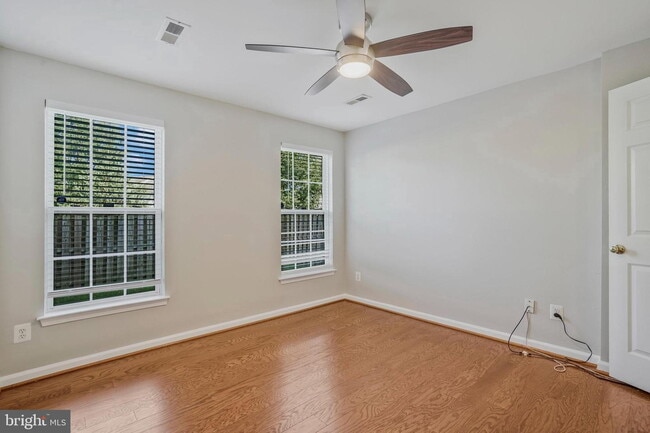 Building Photo - This beautifully maintained brick-front, three-level townhome is located in a highly sought-after...