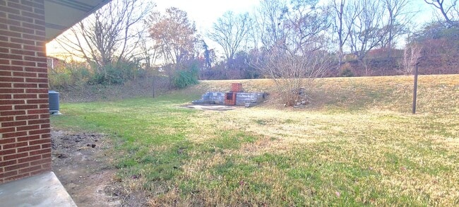 Building Photo - HALF OFF FIRST MONTH RENT! Single family brick home with full unfinished bsmt & detached garage