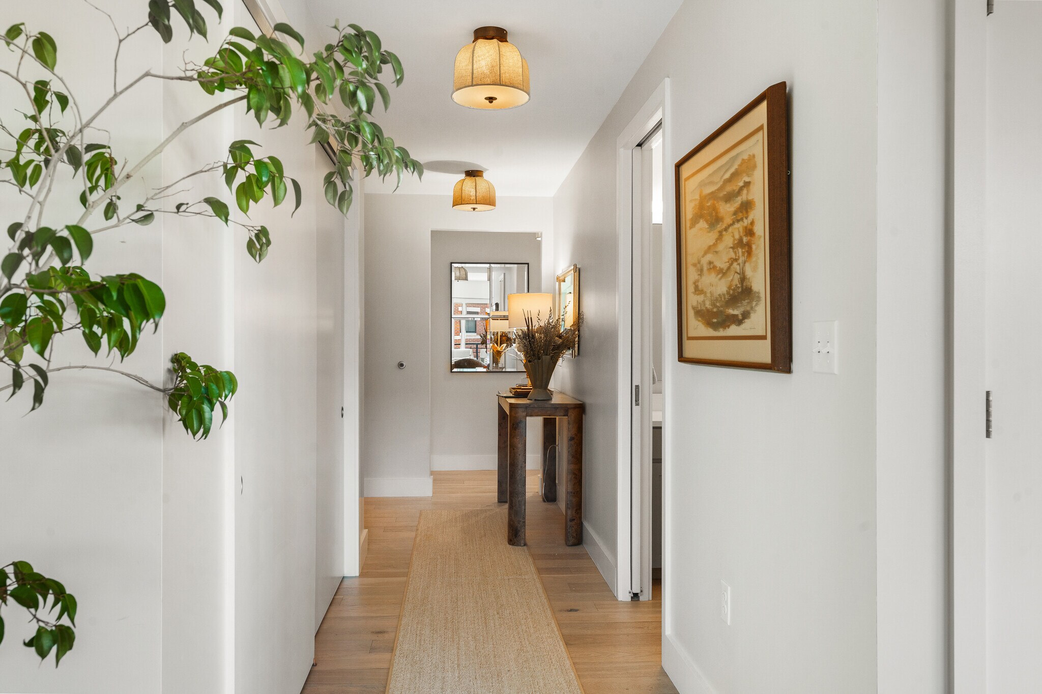 Back hallway, to the left of the entrance, houses the 2 ensuite KING bedrooms - 383 Commercial St