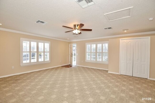 Building Photo - Luxurious 4/3 Waterfront Home with an In-ground Spa, an In-law Suite and a 2 Car Garage in the Hi...