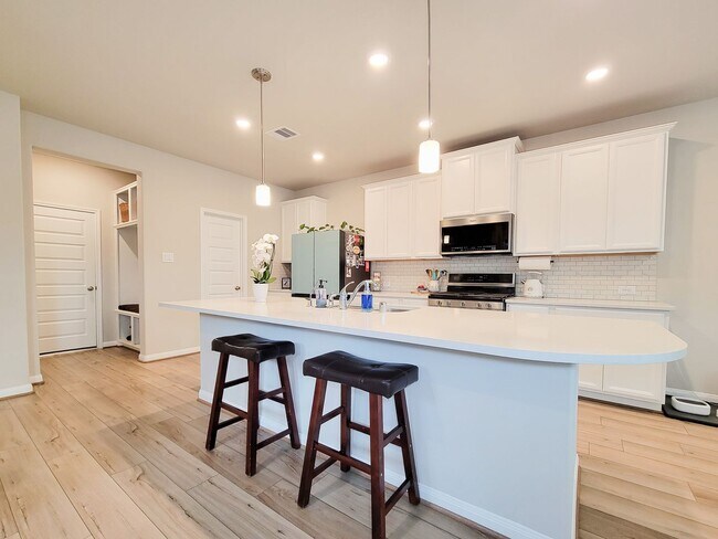 Building Photo - A true gem on a quiet corner lot, this spacious and sun-filled home is tucked away from street no...