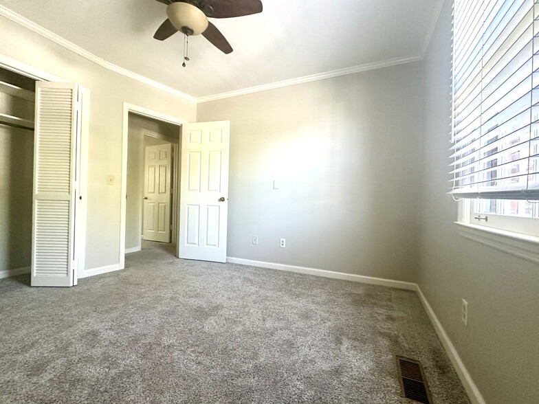 Bedroom with west facing windows, ceiling fan and carpet - 2312 18th Ave S