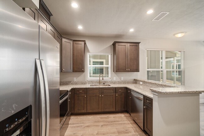 Building Photo - The Reef Townhome NOW LEASING FOR FALL 2026!