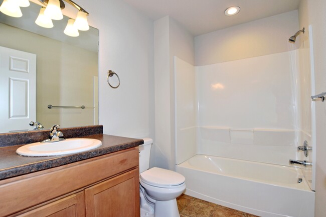 Shared upstairs full bathroom with NEW lighting and toilet - 6349 Orchard Park Dr