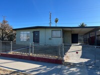 Building Photo - 3 Bedroom House with New Paint, Wood Floor...