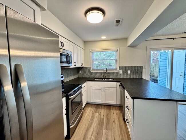 Building Photo - Completely Renovated & Ready 02-25-26! 2 Primary Suites, All Appliances Convey and Dog-Friendly!