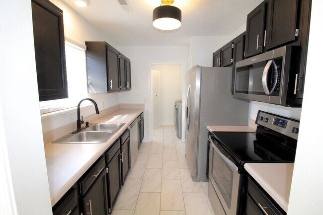 Building Photo - Discover modern living in this recently re...