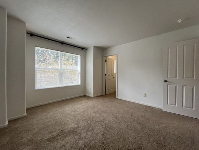 Building Photo - Beautiful 2 Bedroom Townhome with Walk-In Closets Private Deck & Attached Garage