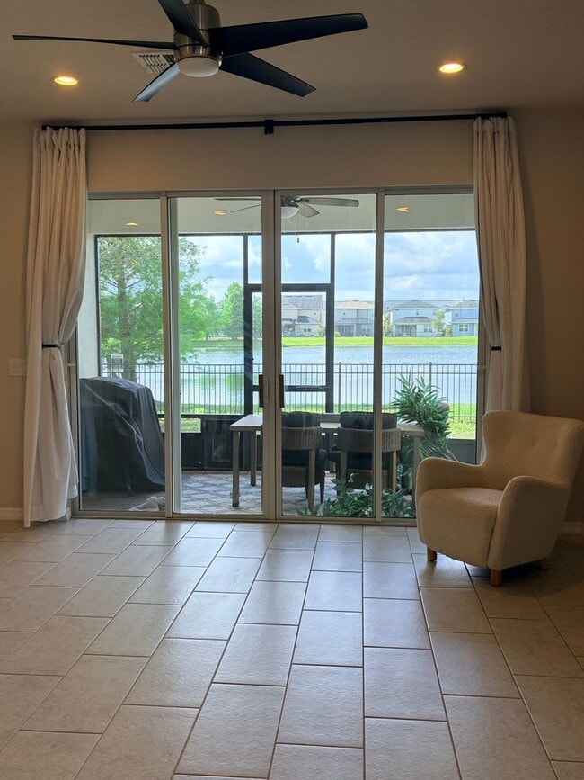 Building Photo - Water Front Home- 4 Large Bedrooms-3 baths Gated Community Call Sheila Campbell 407-687-7900