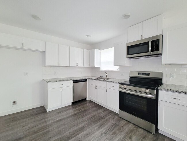 Building Photo - This newly constructed 3-bedroom, 2-bathroom unit offers modern living with 1,150 sq ft of space....