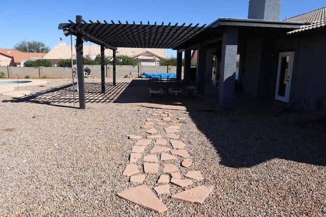 Building Photo - Home With A Pool and Much More!