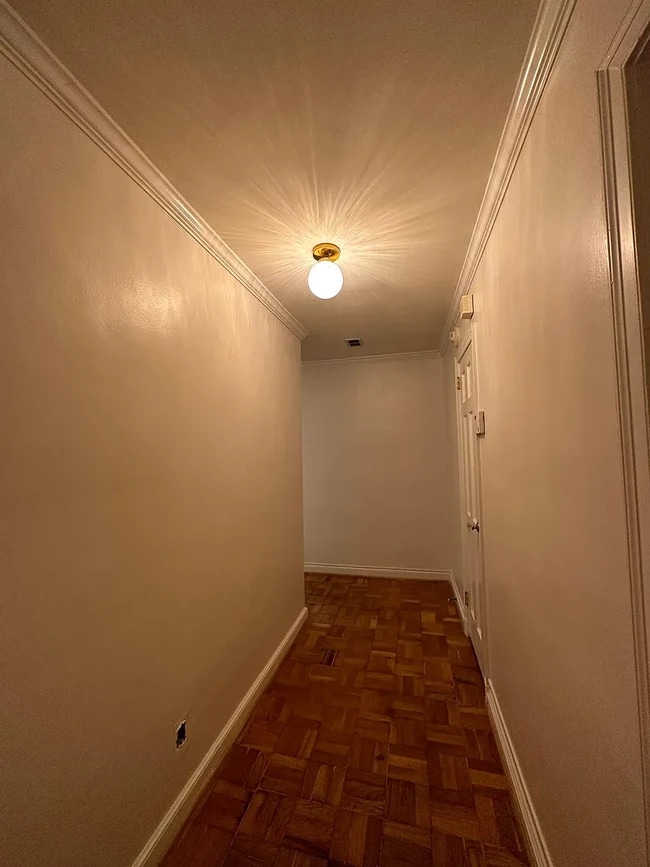 entrance with spacious hall closet and refreshed with Italian lighting - 108 Colville Rd