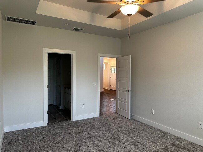 Building Photo - For Lease – Modern 2023 Condo Backing to Greenbelt | Creekside at Pioneer Crossing West