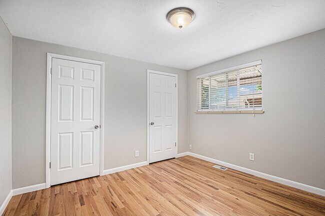 Building Photo - Spacious 4BR with bonus space and a 2 car ...