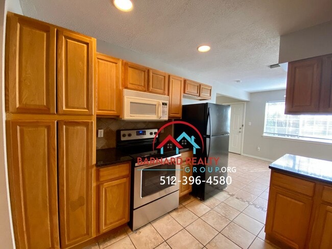 Building Photo - Available July 11: 3 bedroom, 2.5 Bath Duplex with Garage and Fenced Yard