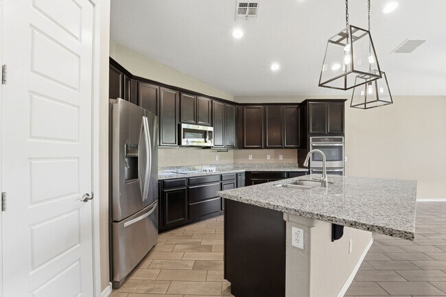 Building Photo - Stunning 4-Bed + Den Eastmark Home with Modern Upgrades Throughout