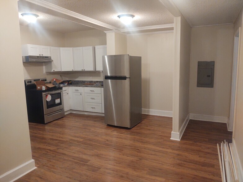 One half of kitchen, second bathroom to right of electrical panel - 116 Houseworth St