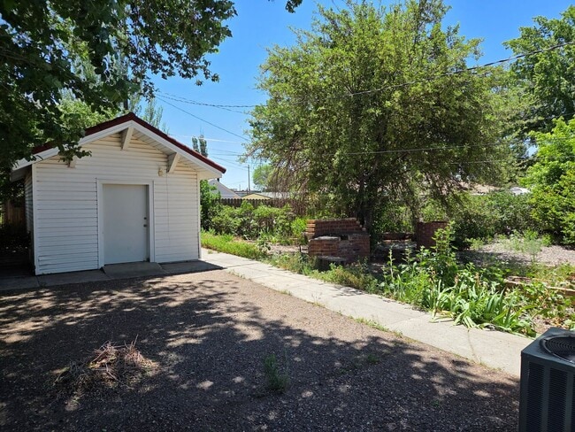 Building Photo - COMING IN JULY! Spacious 4-Bedroom Home in...