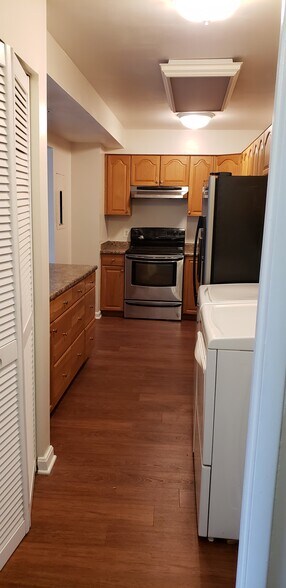 Kitchen with en suite laundry (new oven not pictured) - 6301 Stevenson Ave