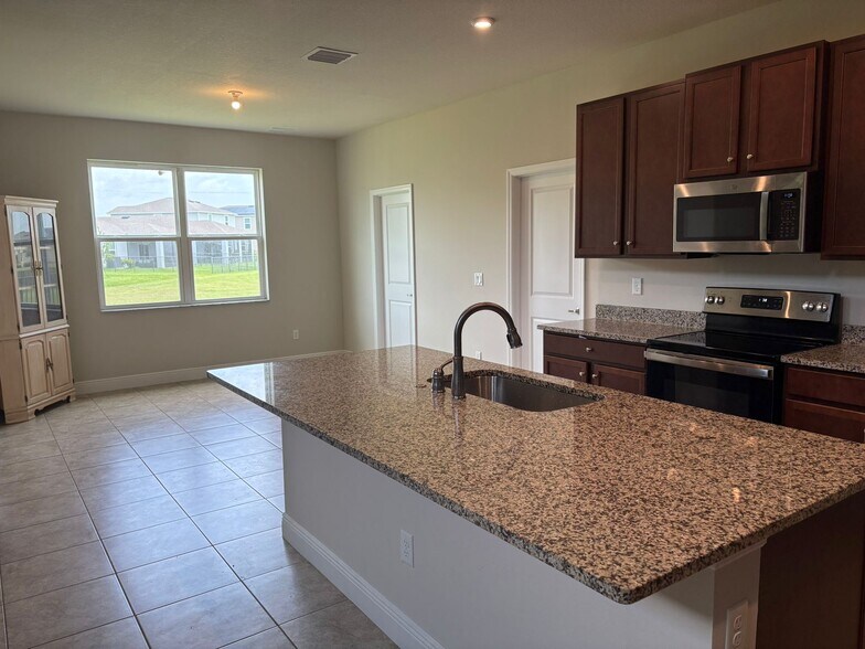 Kitchen/Dining Area - 10976 SW Tessili Way