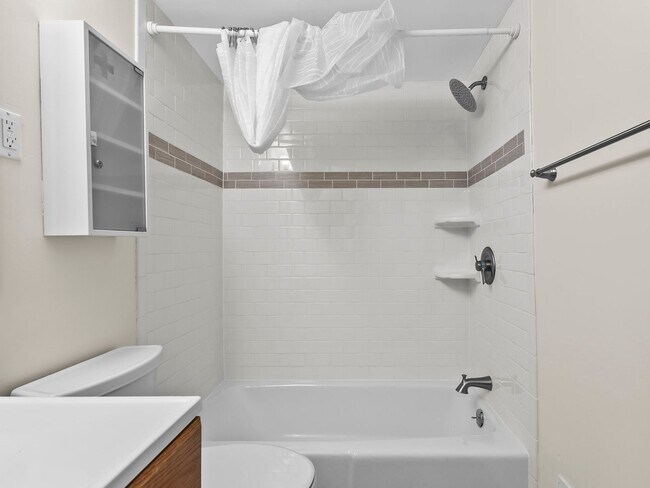 Building Photo - Commuter’s Dream! Large 2BR/2BA Condo Steps from Metro – All Utilities Included!