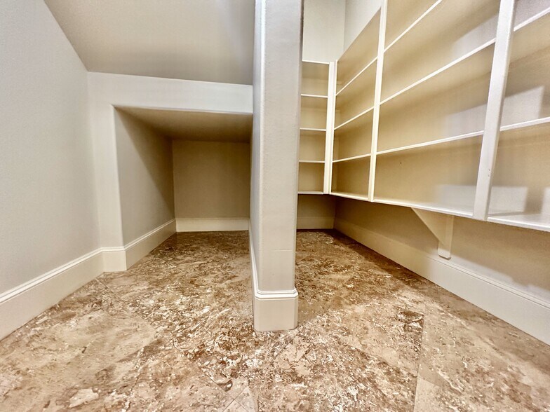 Walk-in pantry with built in shelving. - 6121 Hamman St