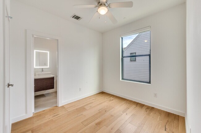 Building Photo - Live Above It All | Sleek Multi-Level Condo with Private Rooftop Deck