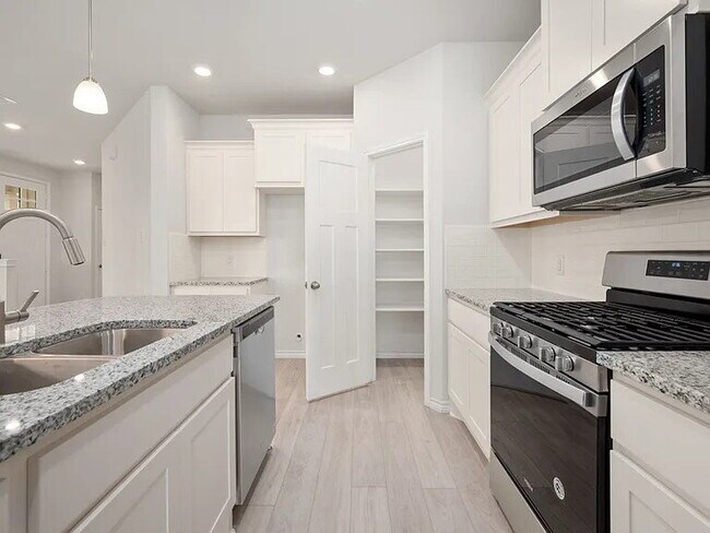 Building Photo - 3 Bedroom 2 bath, 2 garage attached garage with all the appliances to include washer & dryer