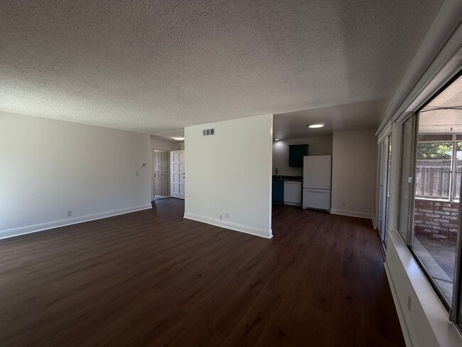 Building Photo - Recently updated home with new floors, paint & bathroom!